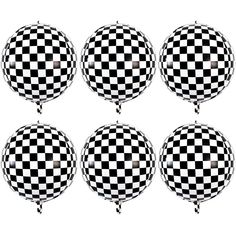 six black and white checkered balloons floating in the air