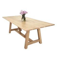 a wooden table with flowers on it