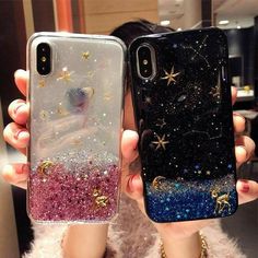 two people holding up their phone cases with stars on them