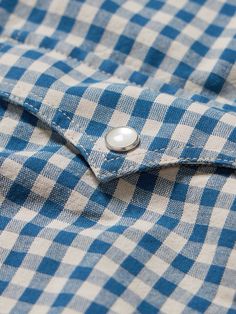 Western style is a perennial favourite, and never truly out of style. Nudie Jeans' 'Sigge' shirt is made from comfortable organic cotton patterned with a classic gingham check. It's finished with traditional angled chest pockets. This product was made from Considered Materials. Find out more about our Craftsmanship Code here. Mens Designer Clothes, Gingham Shirt, Nudie Jeans, Designer Accessories, Gingham Check, Western Shirt, Designer Clothes For Men, Check Shirt, Western Shirts