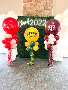 balloons and streamers in front of a wall with the word tampa football on it