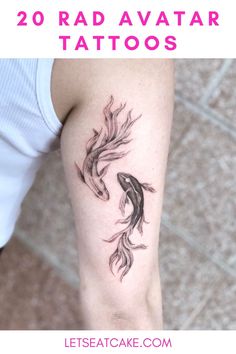 a woman's arm with two fish tattoos on it