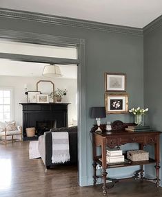 a living room filled with furniture and a fire place