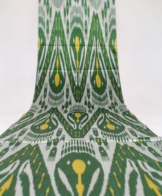 an abstract green and yellow design on a white background, with the bottom half showing