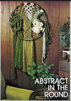 the cover of abstract in the round, featuring macrami and other decorative items