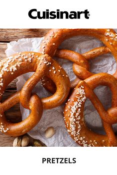 some pretzels are sitting on top of paper