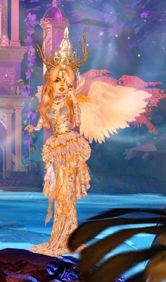 a woman dressed up as a fairy standing in front of a castle with an angel on it