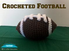 a crocheted football sitting on top of a green surface with the words crocheted football written across it