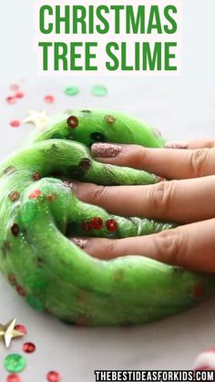 a person's hand with green christmas tree slime on it and the text overlay reads, how to make homemade christmas tree slime slime