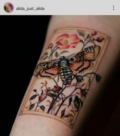 a tattoo on the arm of a woman with flowers and butterflies around her body, in front of a black background