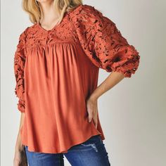 This Top Is Just Darling! The Sleeves Are A Combination 3/4 And Balloon Sleeve With Elasticized Cuff. The Floral Crochet Accents On The Front Top Includes A Button Closure. It Is Comprised Of 100% Rayon Body And 100% Polyester Crochet Accent. It’s An Oversized Fit, So Sizing Down Is An Option Depending On How You Prefer Clothes To Fit. There Is A Slight High/Low Hemline. S: Bust 34-36”, M: Bust 36-38”, L: Bust 38-40” Fall Brunch Blouse With Lace Sleeves, Polyester Crochet, Ruffle Neck Blouse, Gold Blouse, Plaid Vest, Oversized Tunic, Floral Crochet, Crop Top Shirts, Lace Crop Tops