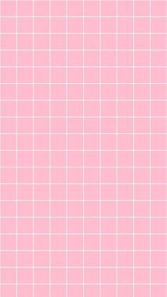 a pink tiled wall with white squares on it