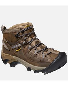 a pair of brown hiking boots with laces