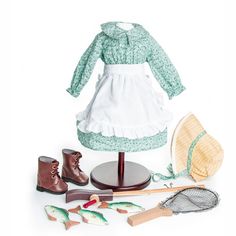 the doll is dressed up and ready to play with her clothes, shoes, and other accessories