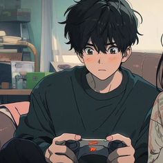 two people sitting on a couch holding game controllers