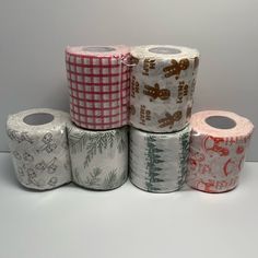 several rolls of toilet paper with designs on them