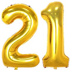 the number twenty two is made out of gold foil balloons and sits in front of a white background