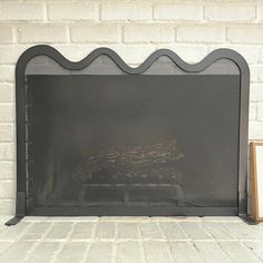 a fireplace with a fire place next to it on a white brick wall and floor