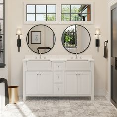 a bathroom with double sinks and mirrors on the wall