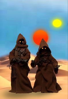 two toy figures are standing in the desert