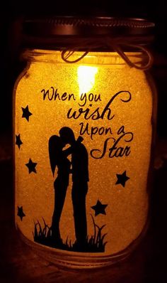 a mason jar with the words when you wish upon a star painted on it, there is