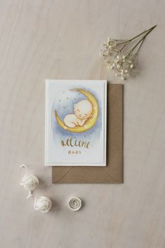 Handmade watercolor WELCOME BABY greeting card. Card depicts a minimalistic designe cute sleeping baby on the moon. Handmade watercolor greeting card suitable for: baby shower, welcome baby,  and it can also be personalized. Your chosen greeting and name will be handwritten on the card. With this card, you can greet your friend, loved one. It would be a truly unique and luxurious greeting gift. The card can be framed, making it a wonderful interior decoration piece that will beautify your home. Welcome Baby Cards, Baby Greeting Cards, New Baby Card, Watercolor Greeting Cards, Decoration Piece, Baby Card, New Baby Cards, Gifts For New Mums, Card Gift