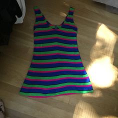 "This is one funky little mini from the 70's. The fabric is a poly/jersey blend and the design is bold colored stripes...hot pink, lime green and royal blue. Scoop necked with zipper down back. It could be worn as a mini dress or as a fun top with leggings. Hand made many years ago, still in nice wearable shape. Measurements: 36\" bust; mid body 33\"; 38\" hips; 51\" hemline; 32 1/2\" tall. Thanks for stopping by my Etsy shop!" Retro Stretch Sleeveless Mini Dress, Retro Stretch Mini Dress For Summer, Y2k Style Green Mini Dress, Green Y2k Style Mini Dress, Y2k Green Mini Dress, Green Y2k Mini Dress, Multicolor Retro Sleeveless Mini Dress, Retro Multicolor Sleeveless Mini Dress, Vintage Cotton Mini Dress