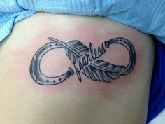 a woman's stomach with a tattoo on it that says fearless in cursive writing