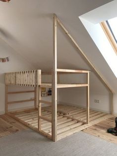 there is a loft bed in the corner of this room, with no sheets on it