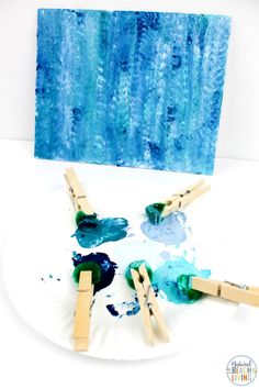 popsicle art project for kids with blue watercolors