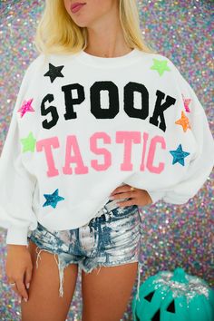 Be the star of the show in our SPOOKTASTIC STAR PULLOVER! This white pullover features fun pink and black varsity Spooktastic letters, accented with colorful star patches. Perfect for adding a unique touch to your wardrobe and bringing out your playful side. (Scaring optional!) All orders are currently shipping within 14 business days. To receive item quicker, expedited shipping is available at checkout. **ALL HALLOWEEN ORDERS MUST BE PLACED WITH EXPEDITED SHIPPING TO GUARANTEE DELIVERY BY OCT. Playful Letter Print Sweater For Fall, White Star Print Sweater For Fall, Fall White Sweater With Star Print, White Crew Neck Sweater With Star Print, White Fun Sweater For Fall, Fun White Sweater For Fall, Playful White Sweatshirt For Fall, Star Patches, People Eater