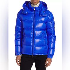 Crafted Of Nylon, Moncler's Maya Jacket Features A Hood With Snap Closures And Fastens With A Center Zipper. Snap Hood Zip-Front Closure Side Zip Pockets Long Sleeves Snap Cuffs 100% Polyamide/Nylon Lining: 100% Polyamide/Nylon Hood Lining: 100% Polyamide/Nylon Dry Clean,Retail For &1750 Plus Tax Imported Blue Nylon Puffer Jacket With Detachable Hood, Designer Nylon Outerwear For Spring, Blue Down Puffer Jacket With Detachable Hood, Blue Nylon Puffer Jacket With Padded Collar, Luxury Blue Hooded Outerwear, Designer Blue Outerwear For Fall, Blue Nylon Puffer Outerwear, Blue Nylon Outerwear With Padded Collar, Luxury Blue Outerwear For Spring