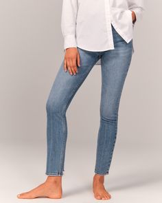 Our high rise skinny jean with figure-defining style and built-in stretch for superior comfort. This jean sits at the waist and looks great with your shirt tucked or untucked. With a form-fitting silhouette from top to bottom, this style is cropped to show a little ankle-and your favorite shoes. Featuring a medium indigo wash, crease detail and frayed hem. Shirt Tucked In, Women's Bottoms, American Clothing, Abercrombie Kids, American Apparel, Abercrombie Fitch, Stretch Denim, Levi Jeans, Looks Great