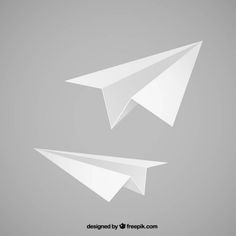 two white paper airplanes flying side by side on a gray background, one is upside down