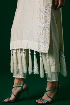 White chanderi silk kurta with all floral over crystal hand embroidery work and tassels on the hem. Paired with a matching pant and an embroidered dupatta. - Aza Fashions Elegant Spring Kurta With Dori Work, Elegant Sets With Dori Work For Spring, Embroidered Cotton Silk Traditional Wear For Summer, Summer Embroidered Cotton Silk Traditional Wear, Summer Kurta In Raw Silk With Zari Work, Elegant Summer Set With Gota Work, Elegant Summer Sets With Gota Work, Summer Cotton Silk Traditional Wear With Zari Work, Summer Traditional Cotton Silk Wear With Zari Work