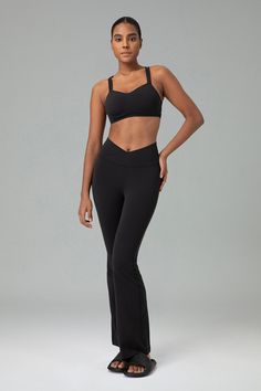 Product details Fabric type 81% Nylon, 19% Lycra Black Care instructions Machine Wash Rise style High Rise About this item Crafted from premium Lycra fabric, it offers unparalleled elasticity, ensuring a perfect fit that enhances your silhouette while providing exceptional comfort and freedom of movement. High-waisted leggings with a V-shaped cross waist design provide a secure and flattering fit. The high waistband offers excellent support, enhances natural curves, and prevents slipping. Boasts Sporty Bottoms With Built-in Bra And Stretch, Sporty Stretch Bottoms With Built-in Bra, Fitted Bottoms With Built-in Bra For Pilates, Sleek Elastane Gym Bottoms, Black 4-way Stretch Pants With Contoured Waistband, Sleek Stretch Workout Pants, Sleek Black Leggings With 4-way Stretch, Sleek Black 4-way Stretch Leggings, Chic Black Leggings With Minimal Stretch