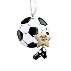 a christmas ornament with a soccer ball and star hanging from it's side