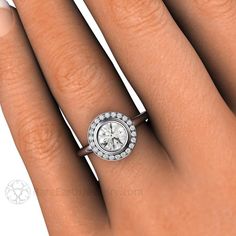 a woman's hand with a diamond ring on it