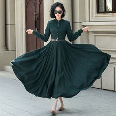 This elegant dark green wool dress combines timeless style with modern sophistication. The fitted bodice features long sleeves and a round neckline. Perfect for colder seasons or special occasions, it's a wardrobe staple that effortlessly blends comfort and chic style.  Details: * 50% wool blend, 50% fiber,nylon; Soft wool fabric; * Polyester lining * Round neckline * Two side pockets * Back zip and front buttons closure * Long sleeve * Mid calf length * The belt model wears is not for sale * Perfect for autumn and winter * Dry clean MODEL SIZE Bust 85 cm(33.4") Waist 67 cm(26.7") Height 168cm (5' 6") She wears size XS Choose CUSTOM Order if you * Need a better fit * Can't find your size in our size Chart * Change the Style * Chang the Length * Your Height is not Between 5'1" - 5"9" * Your Wool Dress Winter, Winter Wool Dress, Wool Maxi Dress, Warm Winter Dresses, Long Wool Skirt, Midi Skirt With Pockets, Dark Green Dress, Custom Dress, Dress Winter