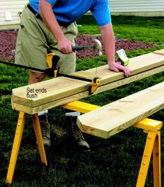 a man is using a saw to cut wood