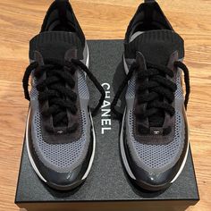 Chanel Black & Grey Slip On Sneaker With Laces. Clear Cc. New In Original Box. Never Worn. Designer Gray Lace-up Sneakers, Luxury Gray Sneakers With Round Toe, Luxury Gray Round Toe Sneakers, Designer Gray Sneakers With Round Toe, Chanel Trainers, Chanel 2019, Chanel #1, Navy Chanel, Shoes Chanel