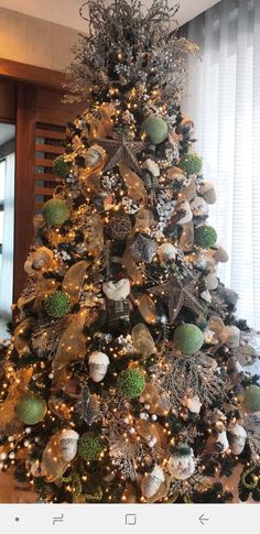 a christmas tree decorated with ornaments and lights