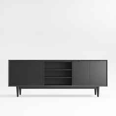 the sideboard is made from black wood and has two doors, one door open to reveal