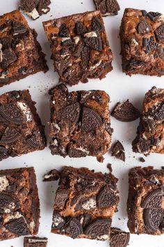 brownies with oreo cookies and white chocolate chips on top are cut into squares