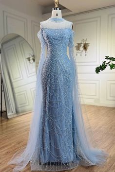 Neckline: High NeckSilhouette: MermaidSleeve Length: Ruffle SleevesEmbellishment: Beads, Pearls Avatar Wedding, Turtle Neck Gown, Blue Graduation Gown, Pearl Mermaid, Charity Ball, Dresses Fancy, Dream Prom, Winter Formal Dresses, Fantasy Wardrobe