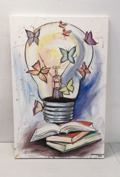 a painting of a light bulb with butterflies flying around it and an open book on the table