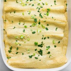 a casserole dish filled with green vegetables