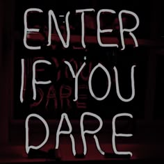 a neon sign that says enter if you dare in white writing on a black background