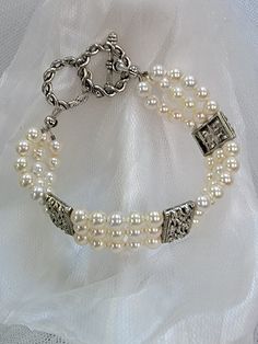 This multi strand Swarovski pearl bracelet is the perfect accent to any wedding gown. There is a silver toggle clasp with two possible circles for adjustments. This bracelet is elegant, it can be customized and matching accessories can be made. Comes gift boxed. USA made by women owned and staffed small business Elegant Multi-strand Jewelry For Formal Occasions, Elegant Round Beads Bracelets For Anniversary, Elegant Adjustable Pearl Bracelet For Formal Occasions, Elegant Pearl Bracelet With Pearl Drop For Anniversary, Elegant Formal Bracelets With Clasp, Elegant Formal Bracelet With Clasp, Elegant Pearl Charm Jewelry For Mother Of The Bride, Formal Adjustable Beaded Pearl Bracelet, Elegant Wedding Bracelets With Clasp