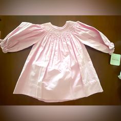 Nwt Pink Smocked Dress With Smocked Flower Detail Design *9months *Two Button Closure Along Collar On Back *Long Sleeve { Traditional, Special Occasion, Church, Party, Southern , Pictures, Portraits, Feminine} Questions? Leave A Comment Below! Cotton Smocked Dress For Baptism, Pink Smocked Dress For Baptism, Cute Long Sleeve Smocked Dress With Smocked Cuffs, Pink Long Sleeve Smocked Dress, Cute Long Sleeve Fitted Smocked Dress, Bebe Dresses, Smocked Dress, Blush Makeup, Fit N Flare Dress